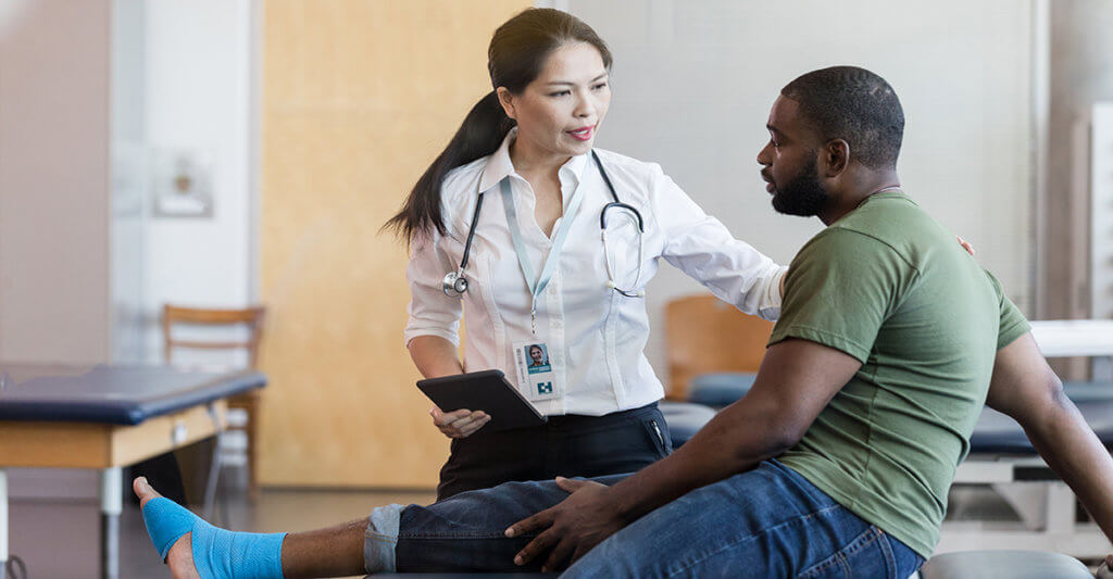 physical therapist treats veteran