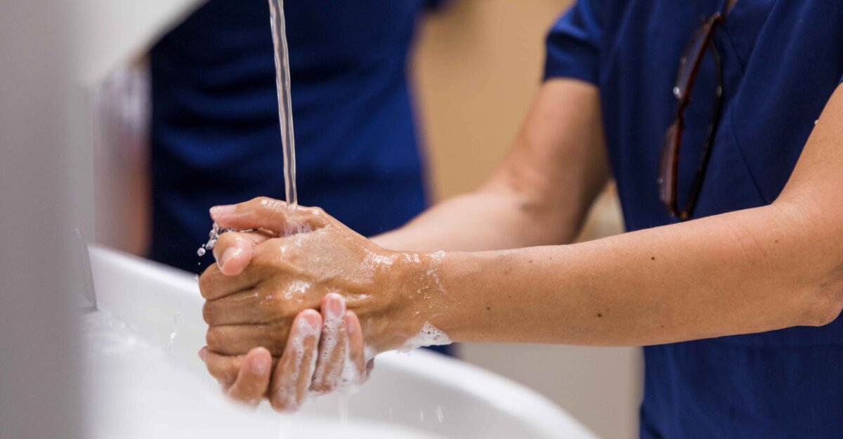 Nurse washing hands for infection control and prevention
