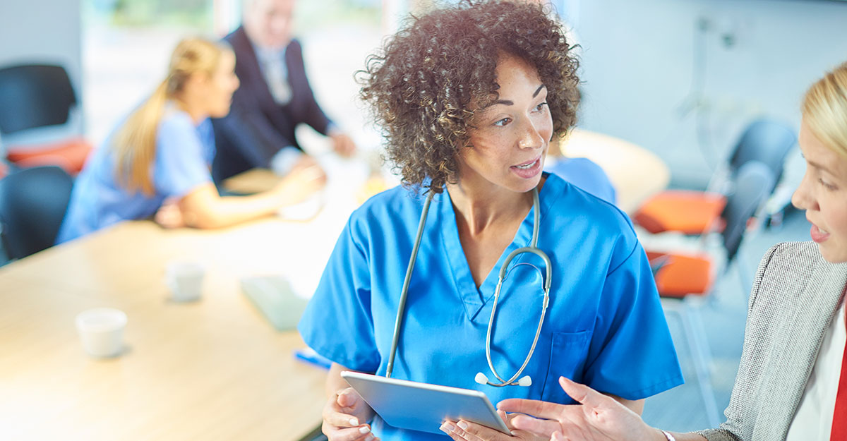 nurse speaking with manager