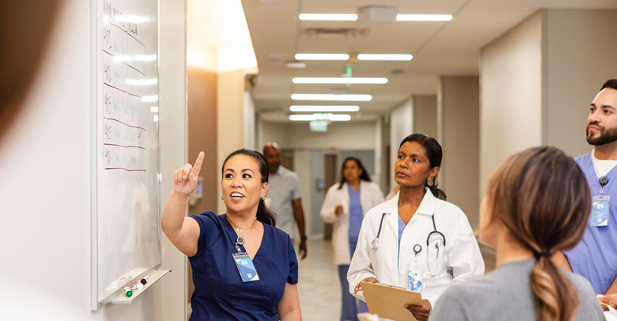 Nurse leader talking to staff